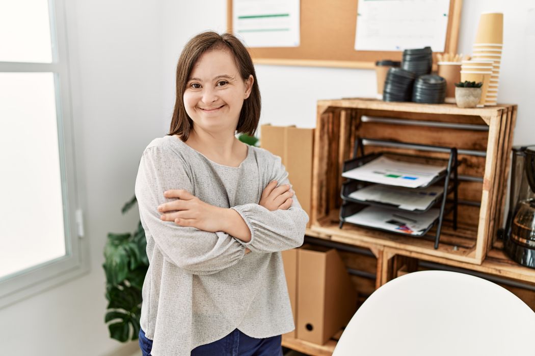 Brunette,Woman,With,Down,Syndrome,Working,Standing,With,Crossed,Arms